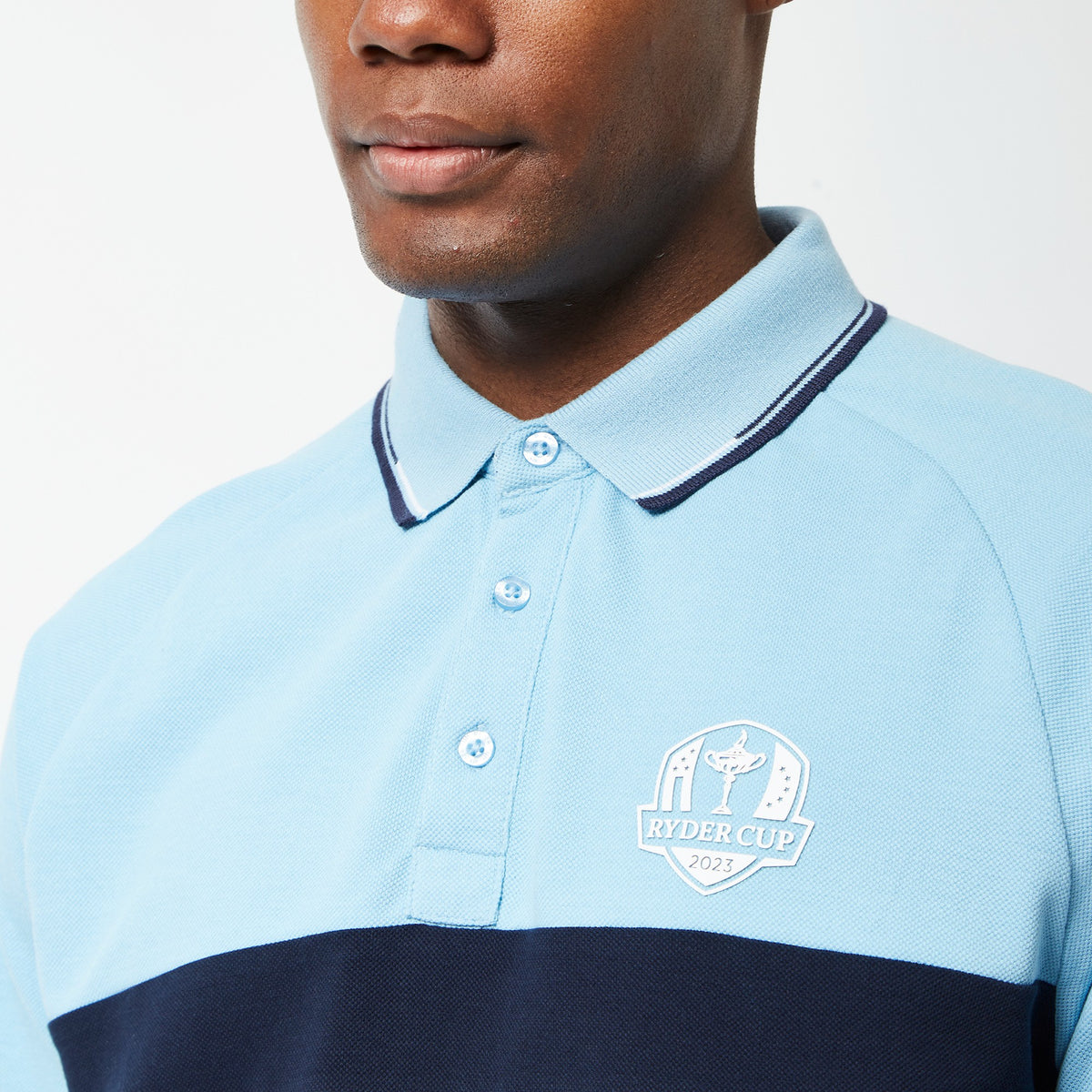 Official 2023 Ryder Cup Men&#39;s Sky Blue/Navy Block Polo - Model Close-up